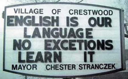 A sign telling people to learn the English language.
