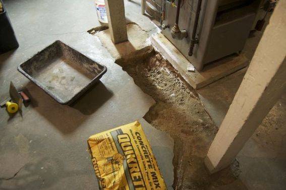 Cement is drying in a crack in the flooring.