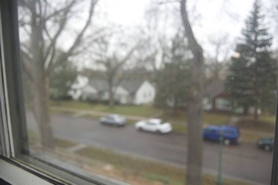 A view of a street through a foggy window.