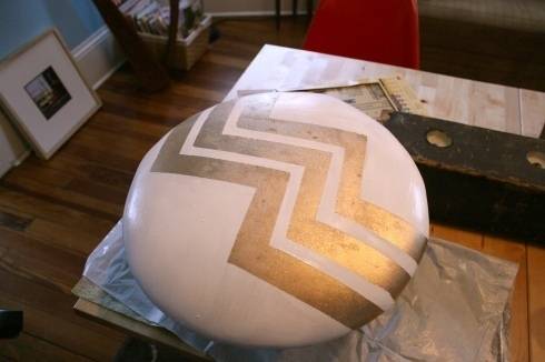 A chevron pattern on a white stool.