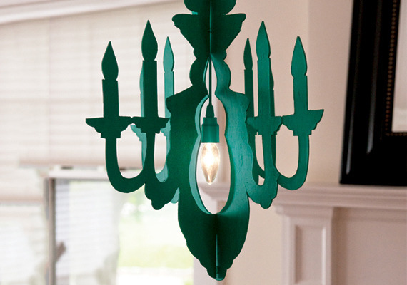 A green chandelier hanging in the room.