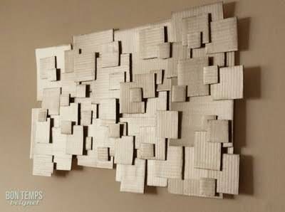 Wall decor with cardboard pieces glued with each other.