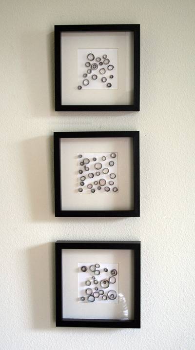 Three wall arts hanging in the wall.