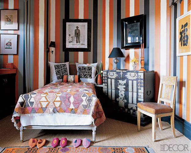 A colorful room highlighted by a heavily pinstriped wall.