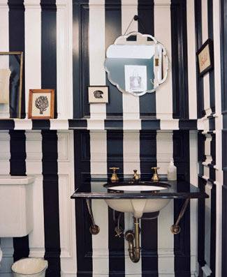 Black and white striped painting on walls in the bathroom.