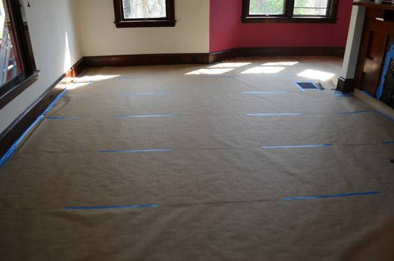Covering floors in brown craft paper to protect the finish
