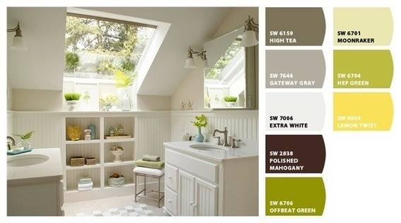 A bathroom with white walls, a window, and flowers in a vase on the sink.