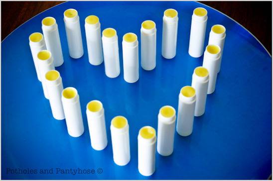 A stack of white and yellow sticks are shaped like a heart.