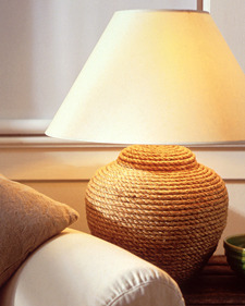 Desklamp with a wide brim shade and a body made of rope.