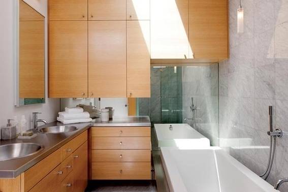 light wood cabinets bathroom and modern tub