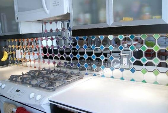 A colorful mirror backsplash for the kitchen.