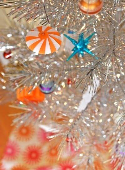 Candy is placed in a silver Christmas tree.