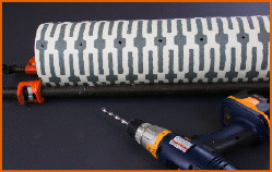 A PVC pipe wrapped in a paper and drilled with drilling machine.