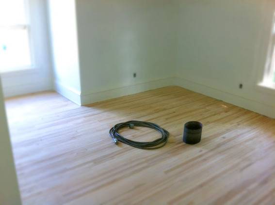 The bedroom, after the floors were sanded