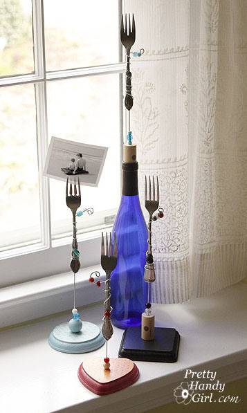 A blue glass bottle with forks