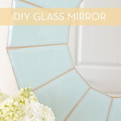 A light colored blue and white DIY mirror.