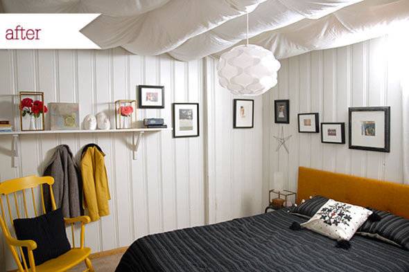 White chandelier hanging above the bed.