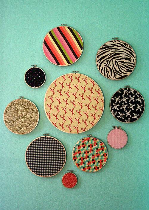 There are ten different sized circle objects, that you can make yourself, on a teal wall.