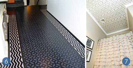 A walkway in a building that has a black and white tile design.