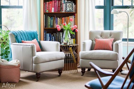 Tufted chairs under bright windows in a living room.