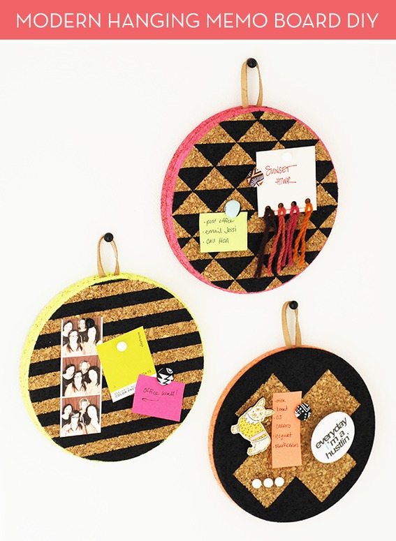 Three round cork and leather hanging memo boards.