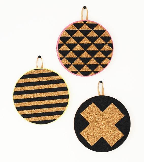 Ornament with triangular design, ornament with stripes, and ornament with a x.