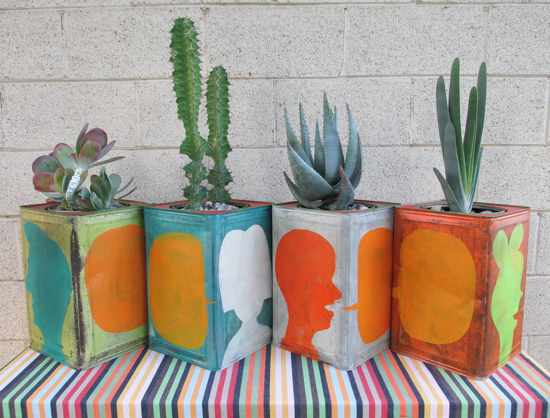 Four plants with hand painted containers.