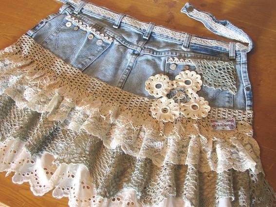 A homemade women's mini skirt is made of denim and lace.