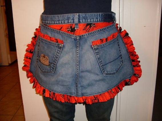 Blue jean apron with ruffled red fringe.