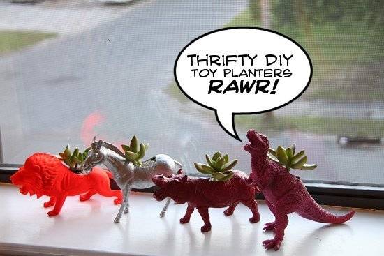 Various toys like a horse, a lion, a rhino, and a dinosaur have been turned into planters with small plants