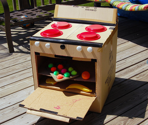 A child's stove made out of cardboard and other materials.