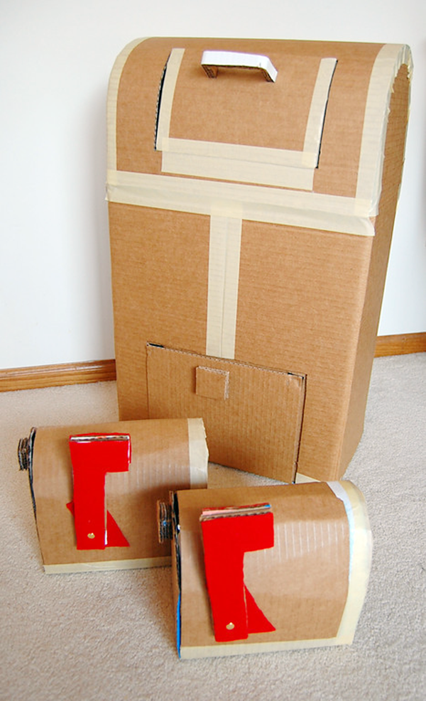 Mailboxes have been made out of cardboard and tape.