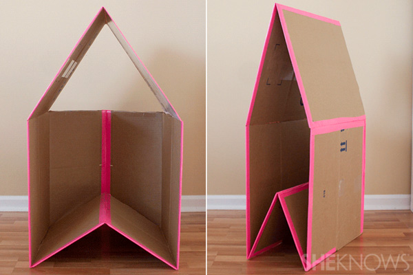A cardboard box with pink tape around it.
