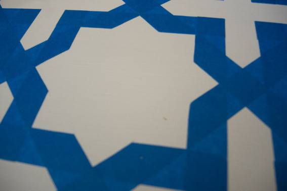 A blue and white floor in the shape of a star.