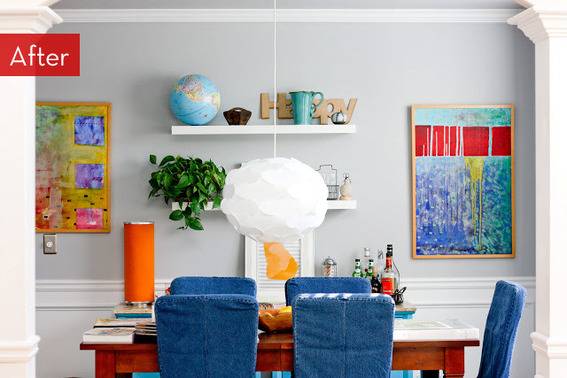 A dining table is surrounded by dining chairs that have blue slipcovers.