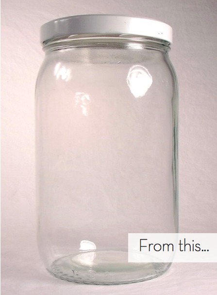 An empty glass jar has a white background.
