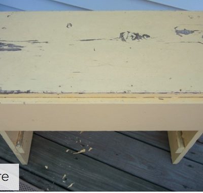 Table that is chipped in different places, and needs a new paint job.