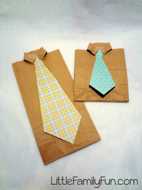 A shirt and tie made out of a paper bag and crafting paper.