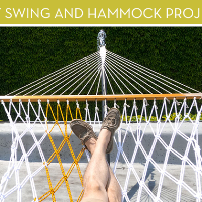A pair of legs laying in a hammock with a yellow stripe.