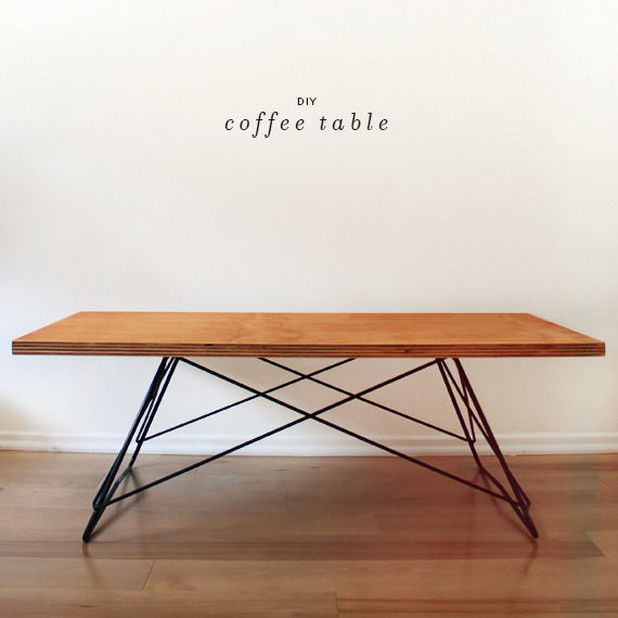 Wood dining table with metal wire legs on top of a wood floor.