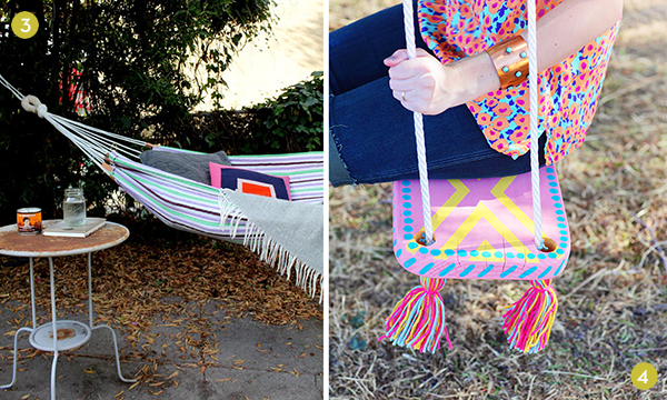 A person is sitting on a swing outside.
