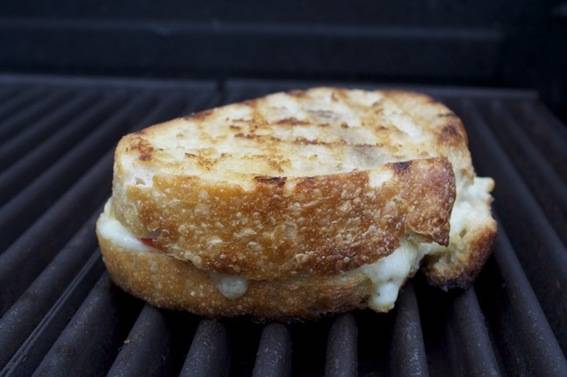 Grilled cheese sandwich on a wire grate.