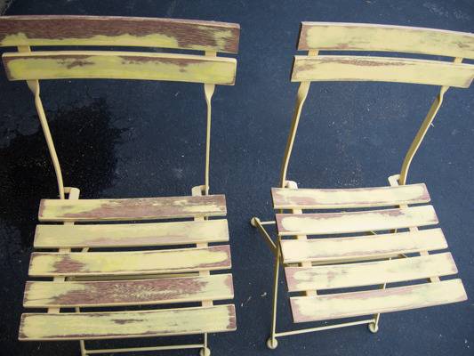 Two old yellow slat chairs.