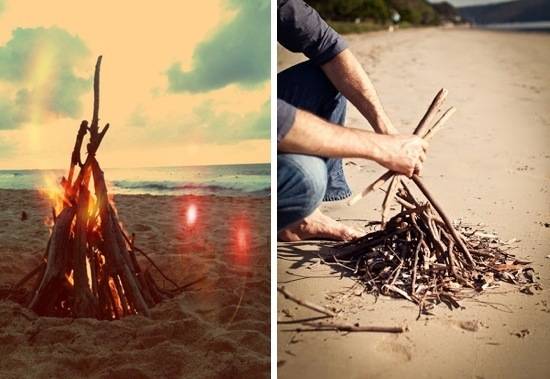 Person is putting together sticks to create a bon fire.