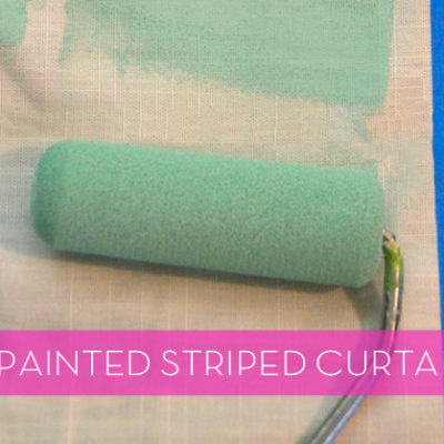 A lime green paint roller paints on white curtains.