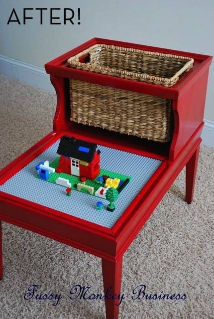 A toy side table in orange brown with a basket and a blue toy area.