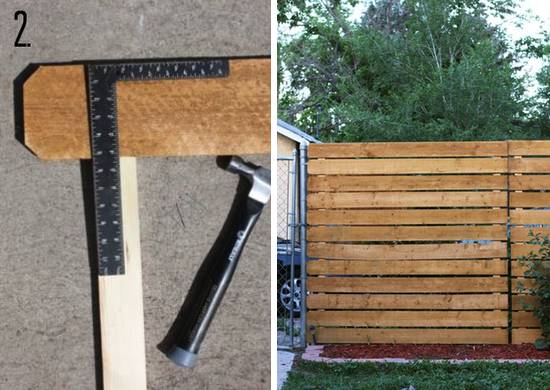 A ruler sits a on a piece of wood nexat to a hammer, then a horizontal slat fence is in a yard.