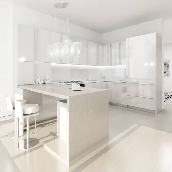 All white modern kitchen, with lots of cabinets and storage.