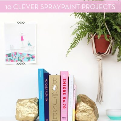 Books in between gold colored rock bookends.