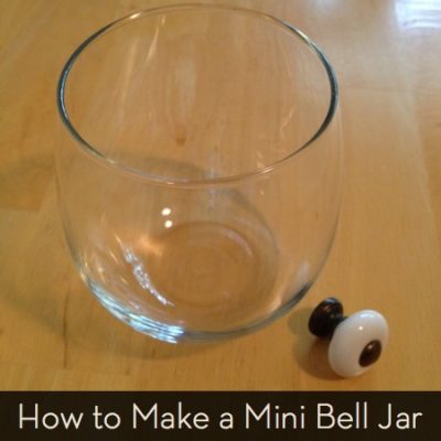 A clear glass is next to a small dis-jointed knob.